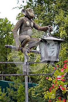 Lantern monkey statue in the park.