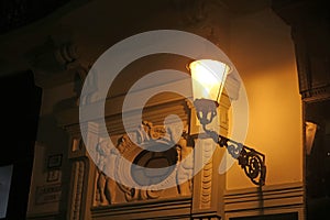 Lantern on the old building at night in Bratislava, Slovakia