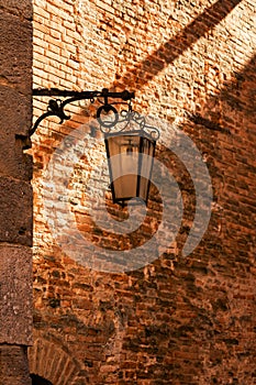 Lantern protruding from stone wall into courtyard in the fortress at the medieval castle