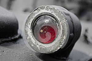 The lantern of a red military armored vehicle is a close-up. close-up of a part of a military armored vehicle or tank.