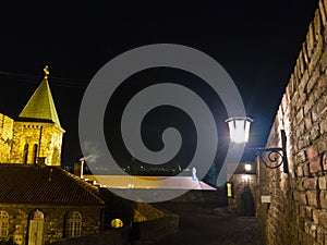 Lantern on a wall at night in front of a church, Kalemegdan fortress in Belgrade