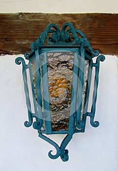 Lantern on the white building wall