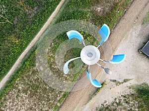 Lantern with windmill turbine top view, renewable energy concept