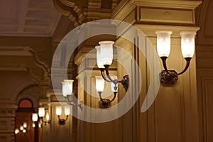 Lanterns attached to columns in a building