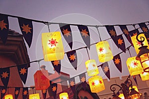 Lanterns and Bunting Strung Above Courtyard Square