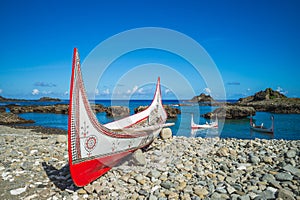 Lanyu traditional canoe at dongqing bay in lanyu, taitung, taiwan photo