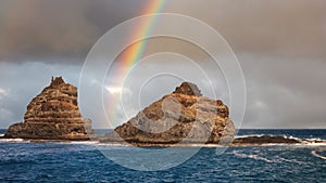 Lanzarote, Punta Fariones, the boat passes very close to them to go to La Graciosa island, Canary Islands, Spain