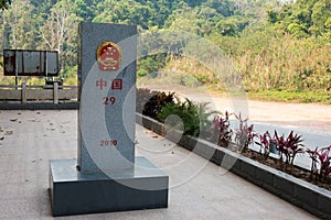 Laos - China border marker between Boten, Luang Namtha Province, Laos and Mohan, Yunnan Province, China.