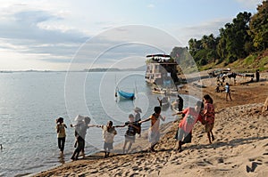 Laos: Fisher men and children seen at the Mekong River cruise between Champasak and Pakse City