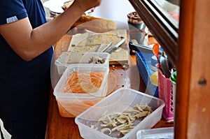 Laotian people cooking Khao Jee Sandwich or Baguette Sandwich photo