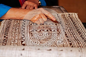 Laotian woman do Batik fabric painting