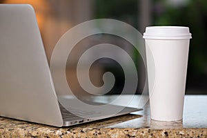 Lap top and coffee cup