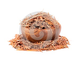 Lapacho herbal tea in wooden bowl, isolated on white background. Natural Taheeboo dry tea. Pau d'arco herb. Tabebuia photo