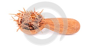 Lapacho herbal tea in wooden spoon, isolated on white background. Natural Taheeboo dry tea. Pau d'arco herb. Tabebuia photo