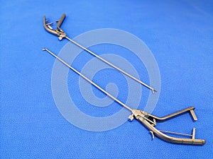 Laparoscopic Needle Holder In Blue Background