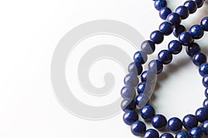 Lapis Lazuli bead necklace isolated on white with copy space photo