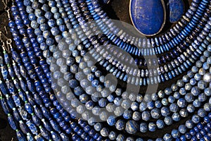 Lapislazuli necklage earrings jewelry on display stand in a shop market photo