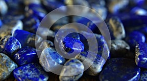 Lapislazuli Selected, beautiful color, laying on the ground, with reflection	valuable, expensive and rare. For making jewelry photo