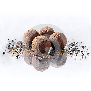 Lapsang souchong tea truffles dusted with tea leaves split open to reveal a smoky complex photo