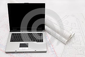 Laptop with architectural plans