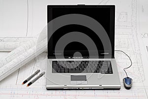 Laptop with architectural plans