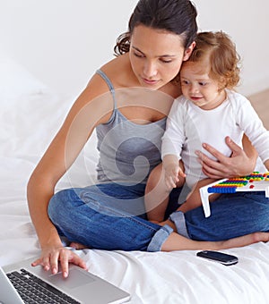 Laptop, baby and mother in bedroom for remote work, learning or online education in home. Freelancer parent, computer