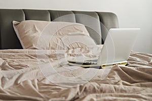 Laptop on bed. work at home or working frome home concept