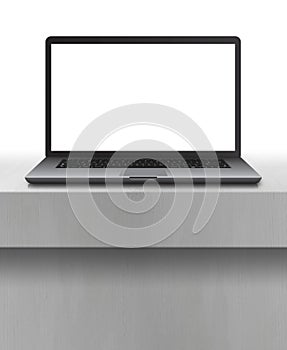Laptop with blank screen on desk