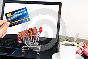 Laptop with blank screen for mockup eCommerce concept with paying money by use credit card. Online Technology Payment