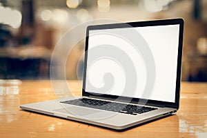 Laptop with blank screen on table - angled