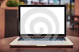 Laptop with blank screen on table. Conceptual workspace, Laptop computer with blank white screen on table, Blurred background.