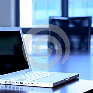 Laptop on boardroom table