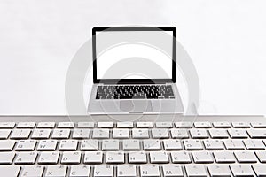 Laptop and book isolated on white background.