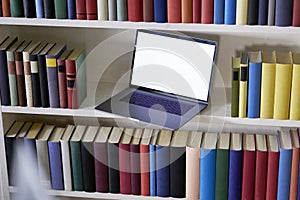 Laptop and books from above with reflections