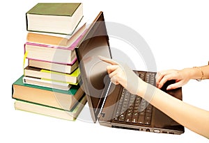 The laptop and books, encyclopedias