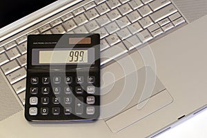 Laptop and Calculator photo