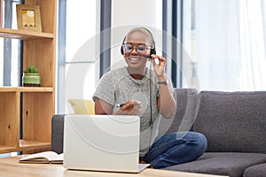 Laptop, call center and black woman with a work from home job doing an online consultation in her home. Customer support