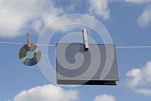 Laptop And A CD On Clothesline photo