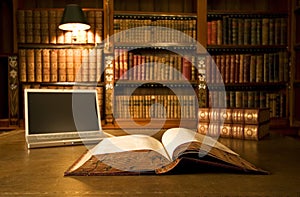 Laptop in classic library photo