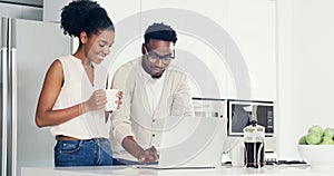 Laptop, coffee and black couple in kitchen typing email for good news or job promotion at home. Happy, technology and