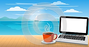 A laptop and a coffee cup on wood table in the sea beach background