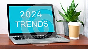 Laptop computer with 2024 trends on screen background, digital marketing, business and technology concept