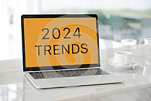 Laptop computer with 2024 trends on screen background, digital marketing, business and technology concept