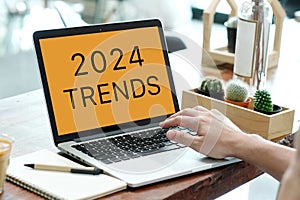 Laptop computer with 2024 trends on screen background, digital marketing, business and technology concept