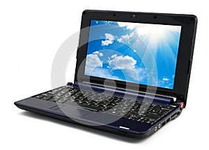 Laptop computer with blue cloudy sky wallpaper