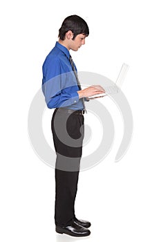 Laptop computer - businessman standing and typing