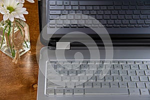 Laptop Computer with Daisies On A Desk