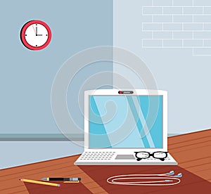 laptop computer with eyeglasses in the workplace