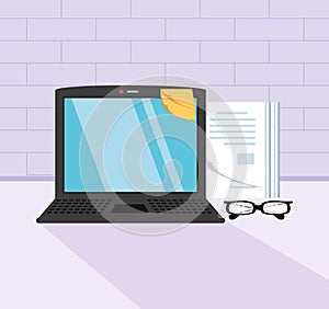 laptop computer with eyeglasses in the workplace