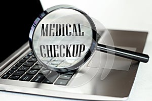 Laptop computer with magnifying glass, concept of search. Medical Checkup